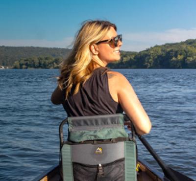 Woman kayaking and camping along CT River