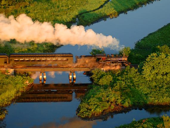 Train on bridge over water (CTVisit)