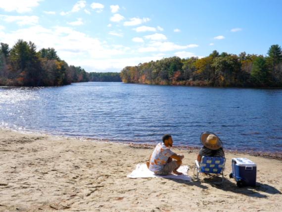 Couple on the beach at Hopeville Pond in late summer
