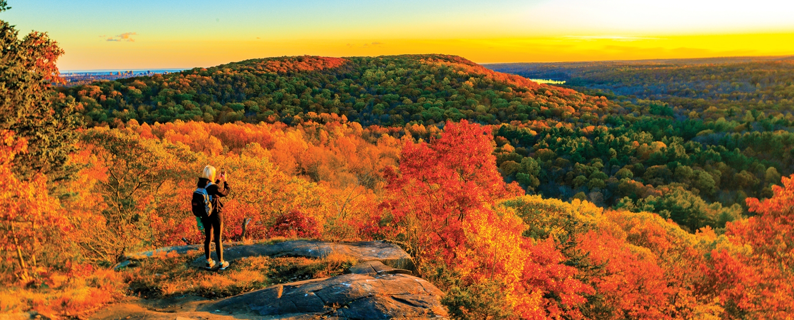 Woman overlooking Sleeping Giant State Park during Fall