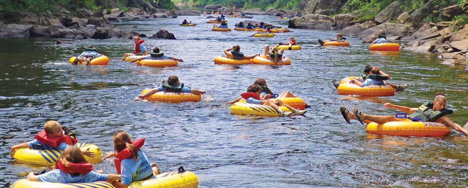 Large group of tubers going down Farmington River at Satan's Kingdom