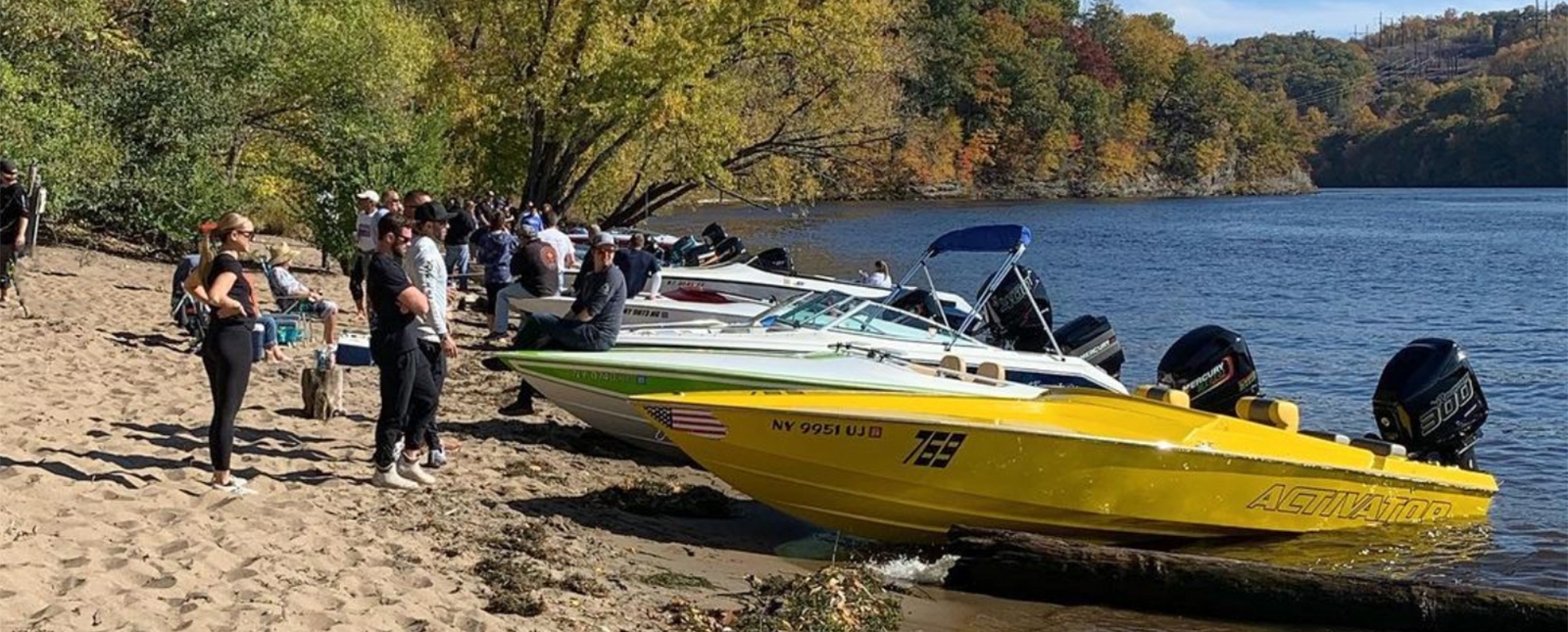 People standing and boats parked at the beach (Instagram@brengus713)