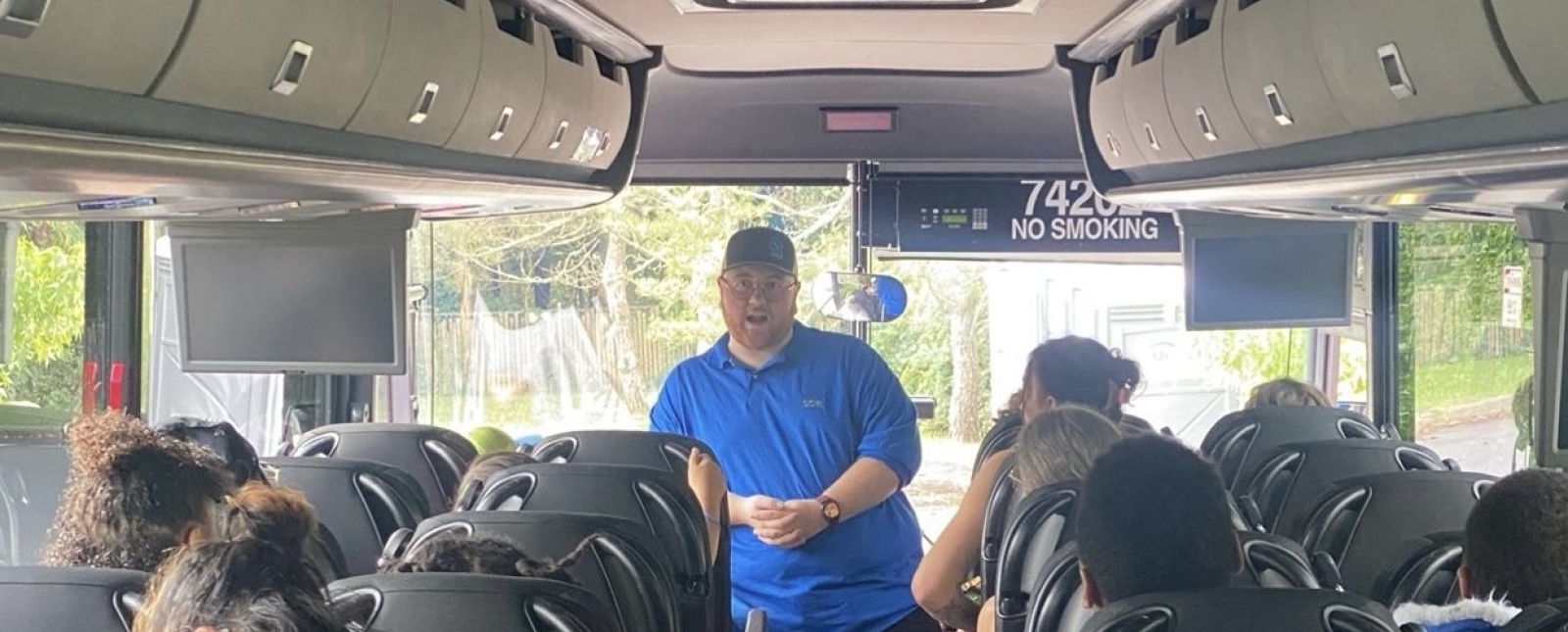 image of inside of ParkConneCT bus with host standing at the front