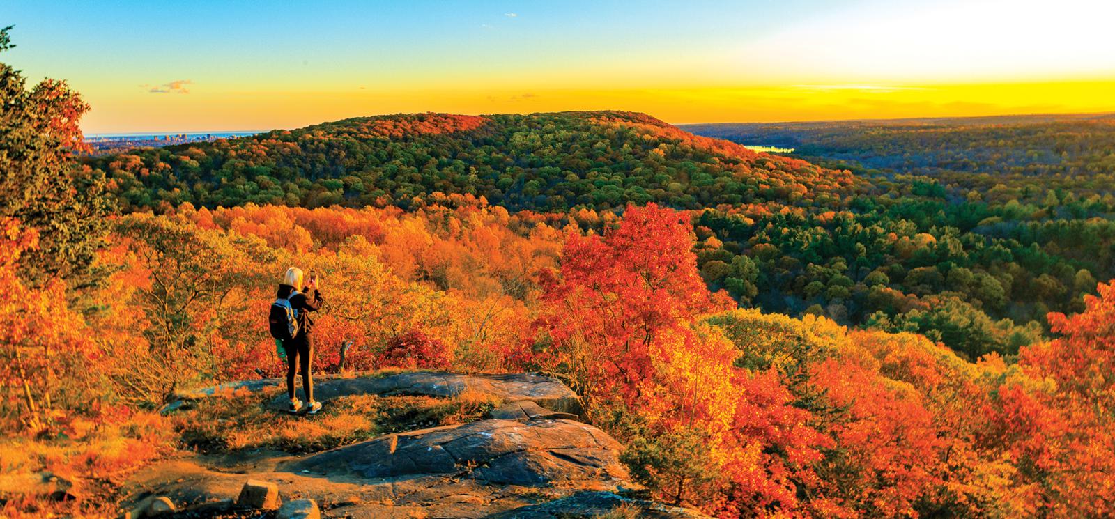 Woman overlooking Sleeping Giant State Park during Fall
