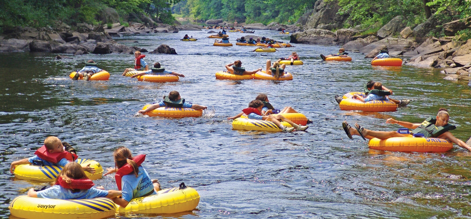 Large group of tubers going down Farmington River at Satan's Kingdom