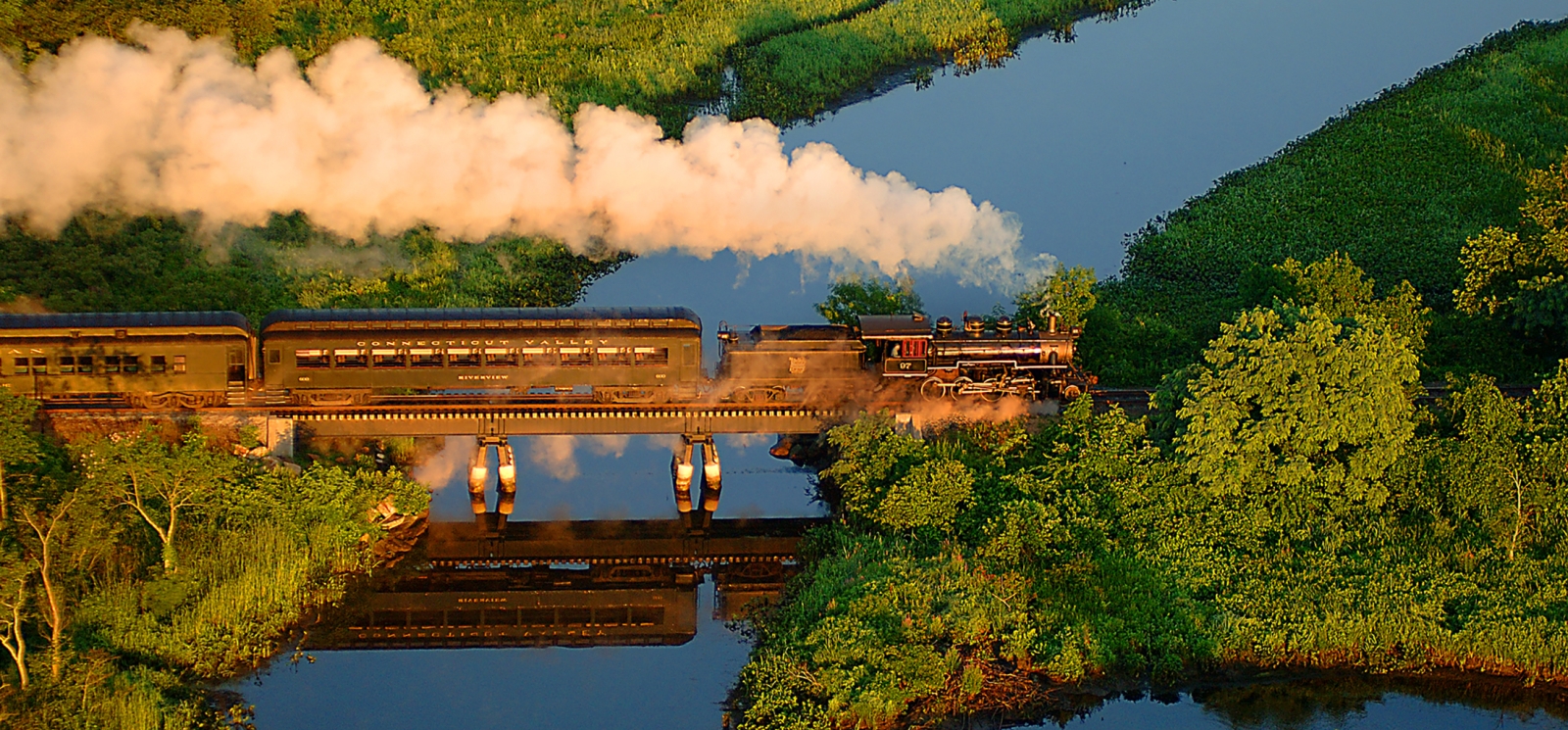 Train on bridge over water (CTVisit)