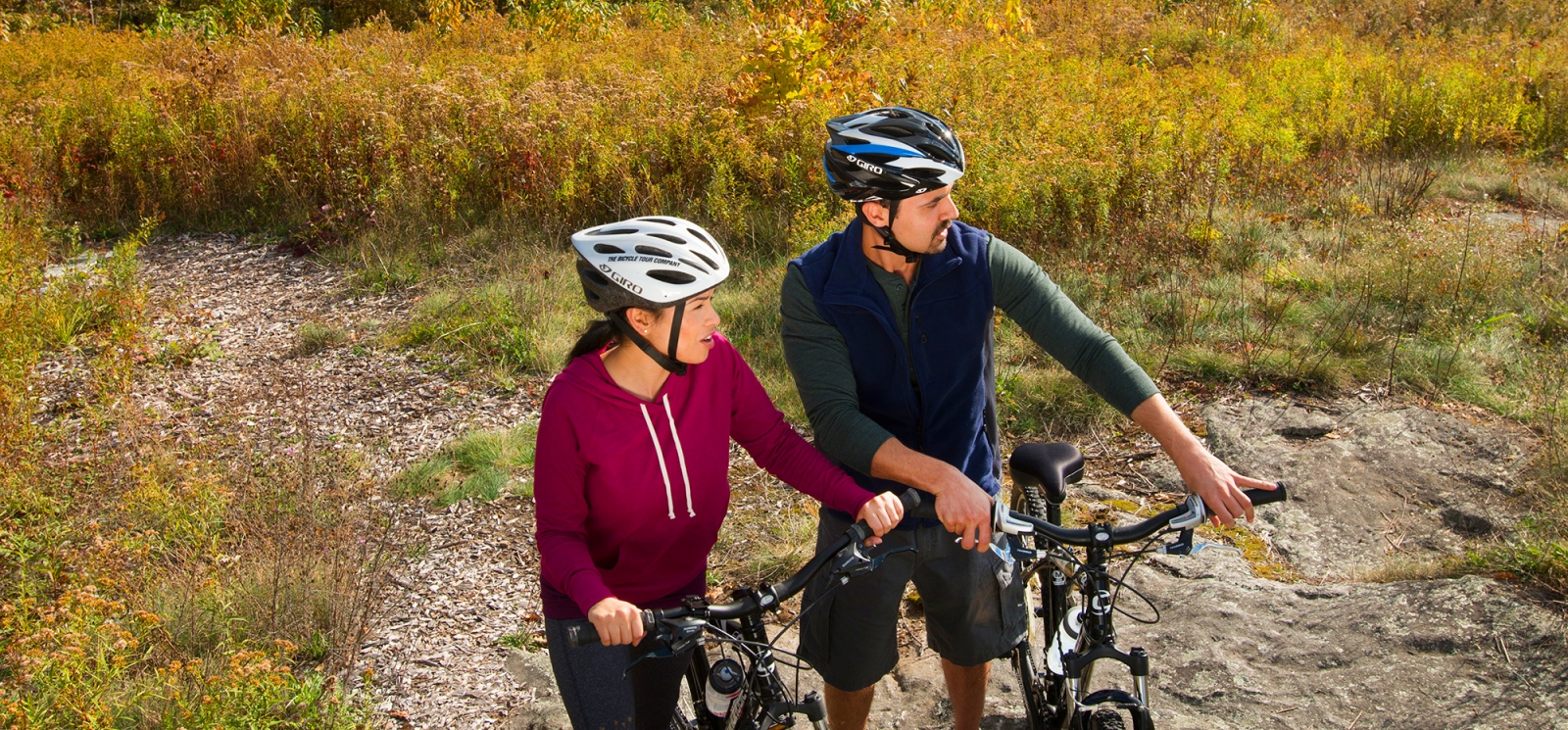 A couple biking in the fall (CTVisit)