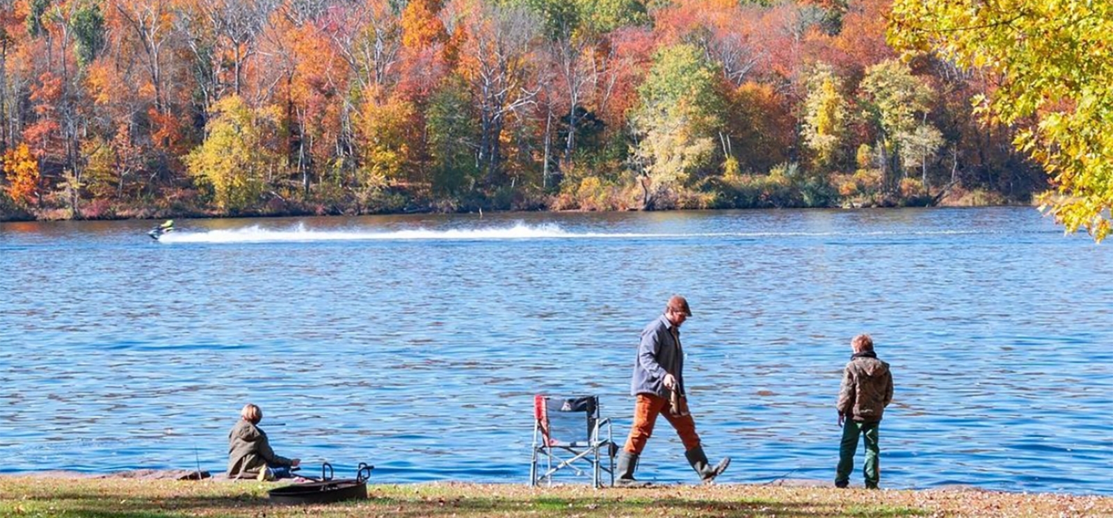 People by the waterside as someone is jetskiing in the distance (Instagram@chandler__anderson)