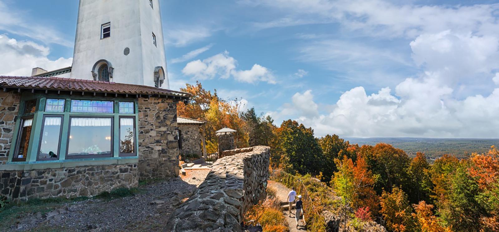 Two people hiking to tower at Talcott Mountain 