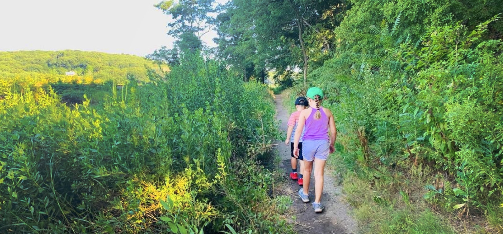 Two children hiking on a path at Stoddard Hill State Park