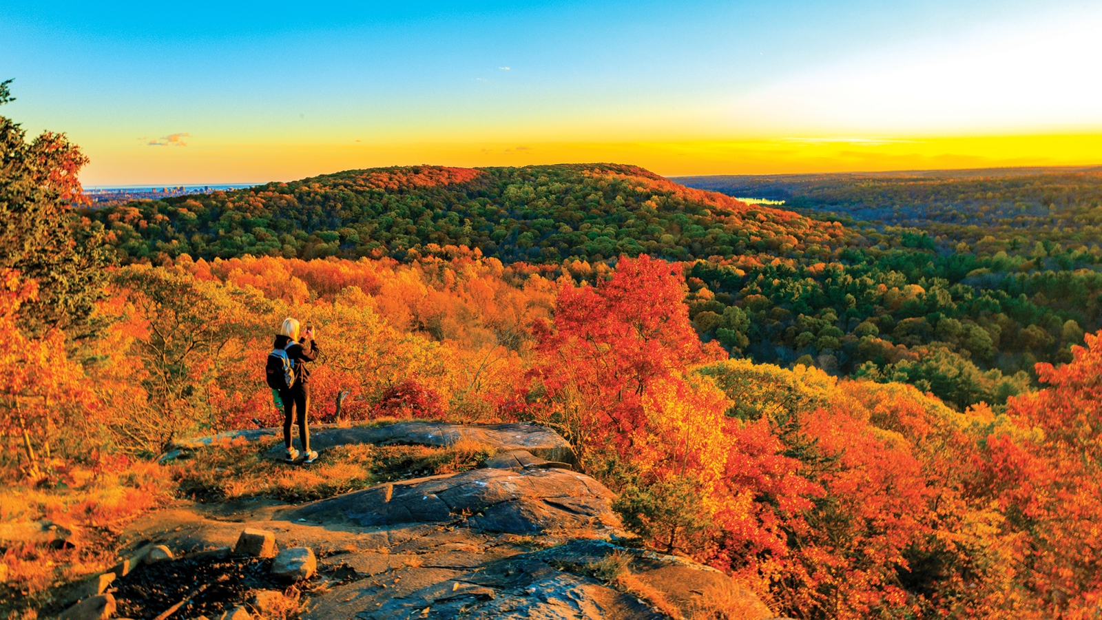 Woman overlooking Sleeping Giant State Park during Fall