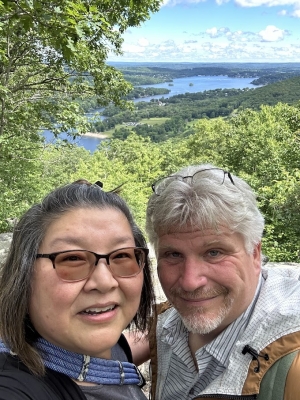 Image of two people taking a selfie with beautiful background