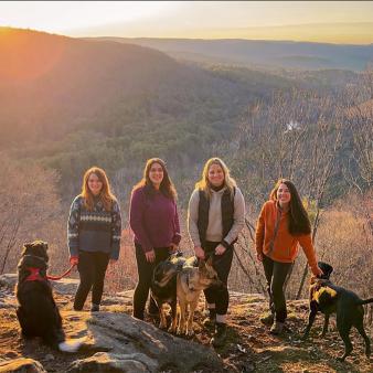 Group of female hikers at peak of American Legion trail (Instagram@earlybirdonthetrail)