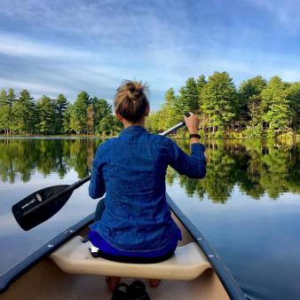 Woman in canoe on Burr Pond State Park (Instagram@thom_carroll)