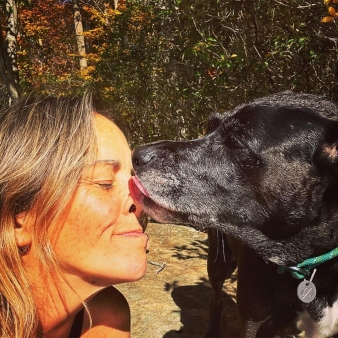 A dog licking womans face (Instagram@bfoxy444life)