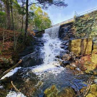 A waterfall from a dam in the woods (Instagram@lexie_franz)