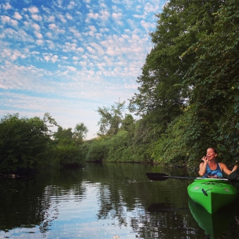 A woman kayaking down the river surrounded by trees (Instagram@mihcaelmaggs)