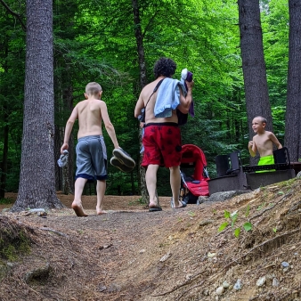 Three people leaving camp to go swimming (Instagram@mistycorio)