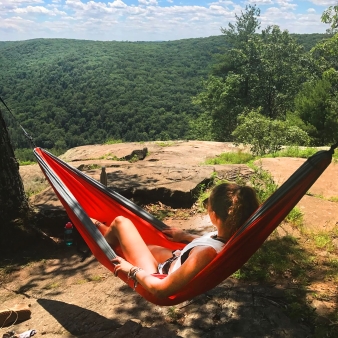 Woman in tree hammock hiking in People's State Forest (Instagram@brookerosedaigle)