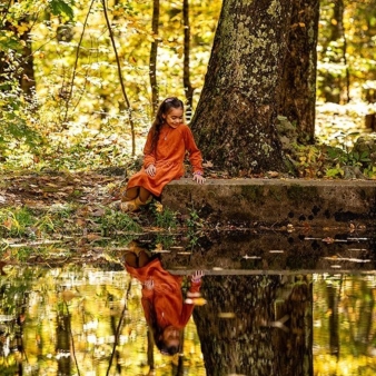 Young girl in forest by the water (Instagram@imagebyjess)