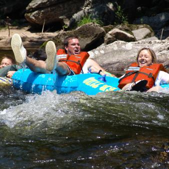 A family tubing down the river (CTVisit)