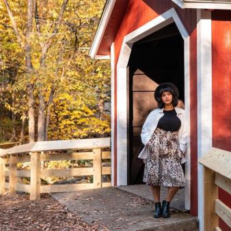 Portrait of woman standing in front of covered bridge (Instagram@pklauder_Images)