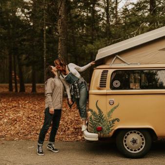 Couple on back of camper at Stratton Brook State Park (Instagram@sarahnoele)