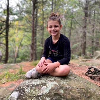 Child at peak of Heublein Tower hike 