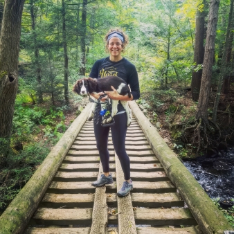 Woman and her dog walking across bridge at Nipmuck (Instagram@thelawlstreetjournal)