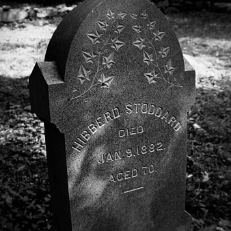 A black and white photo of a headstone at Stoddard Hill State Park