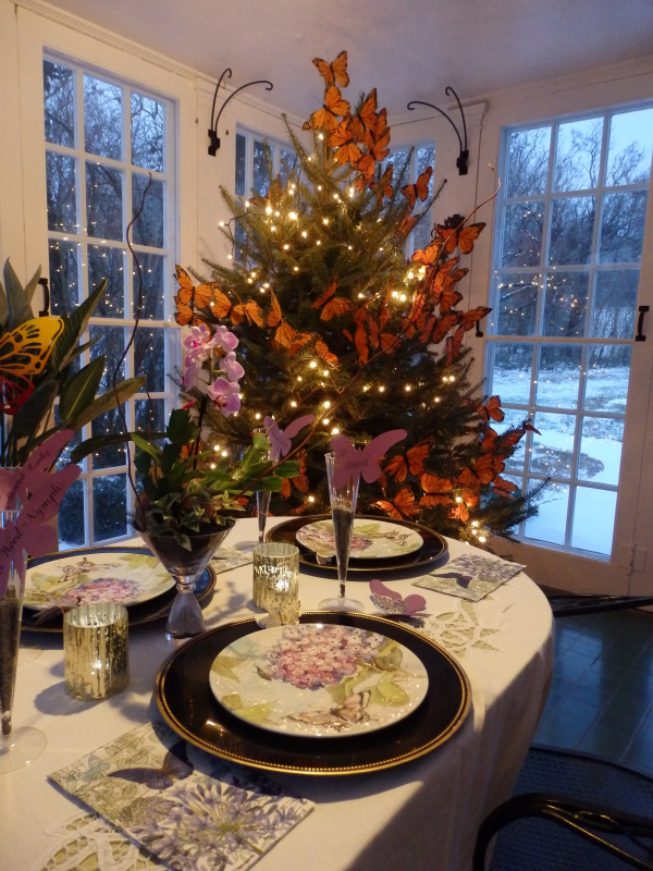 Photo of table and tree with butterfly ornaments 