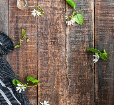 Flowers scattered on a wooden board