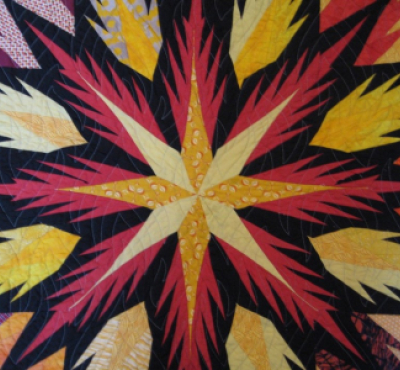 Image of red, yellow, and black quilt