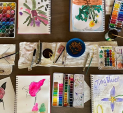 Image of paints and paper 