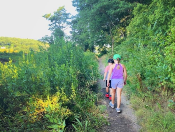 Two children hiking on a path at Stoddard Hill State Park